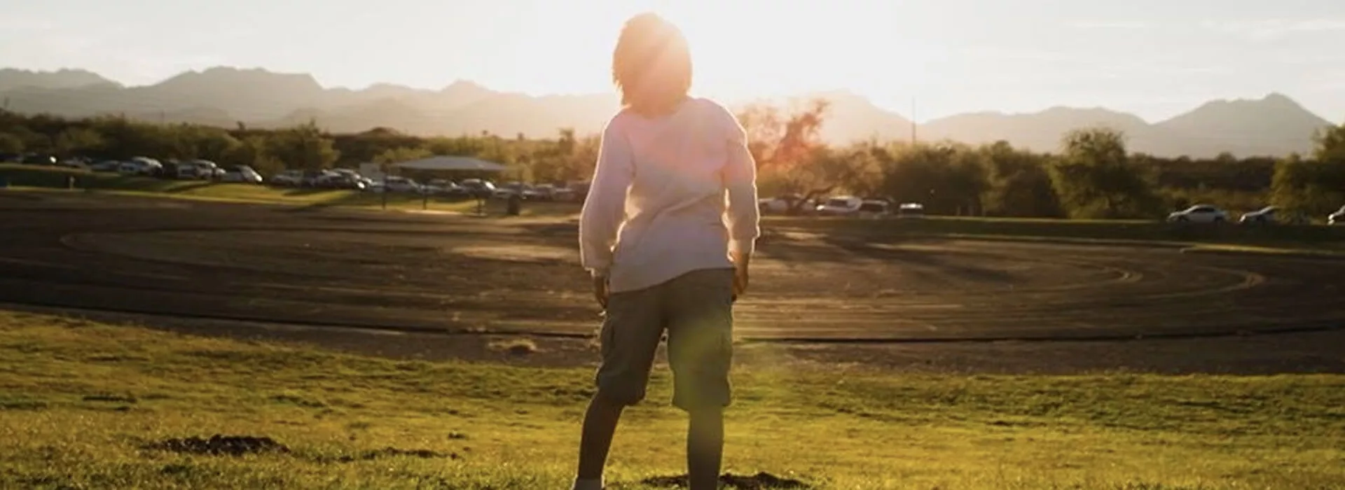 millenial woman standing under the sun
