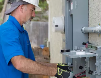 electrician working at power box