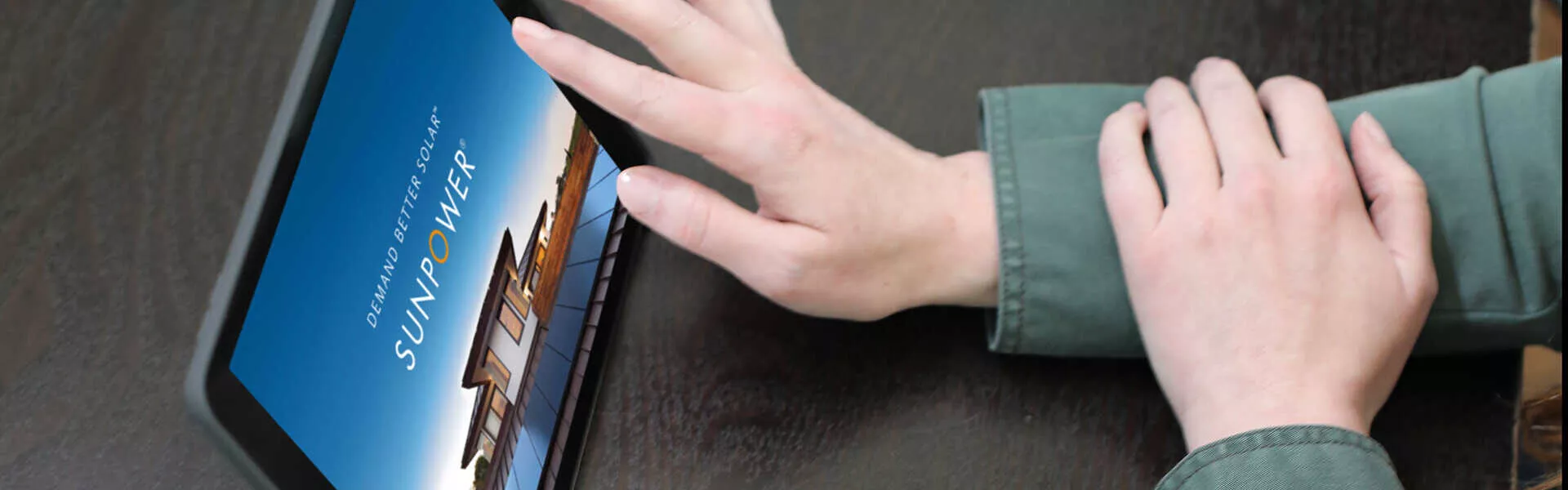 person finding SunPower dealer on tablet