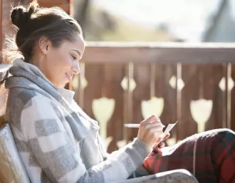 woman smiling and relaxed at her home