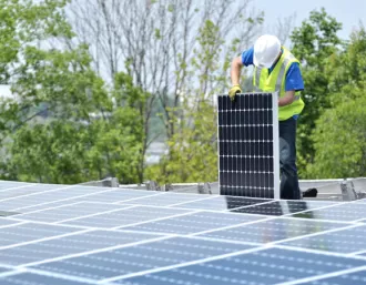 Man installing solar panels