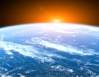 sun cresting the earth from space
