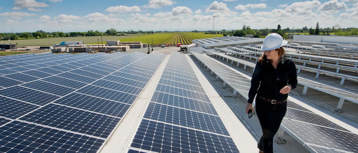 woman inspecting sunpower solar panels woman inspecting sunpower solar panels
