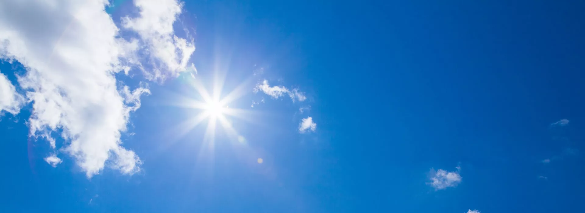 sun rays in a blue sky