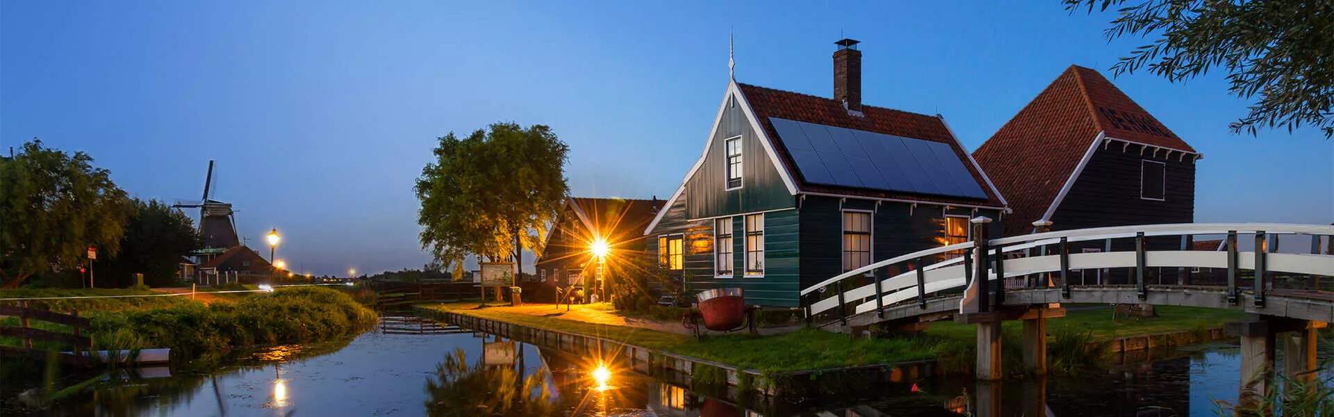 home with solar panels next to canal home with solar panels next to canal
